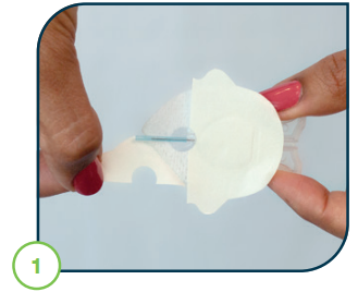 Image_of_hand_holding_the_introducer_needle_and_removing_front_backing_paper.PNG